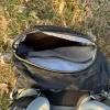 Sac de trek avec poche ouverte.